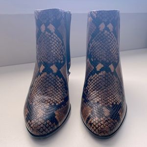 Calvin Klein snakeskin booties. New without tags!
